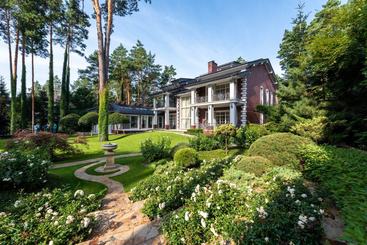 cottage exterior near garden with plants and pathways