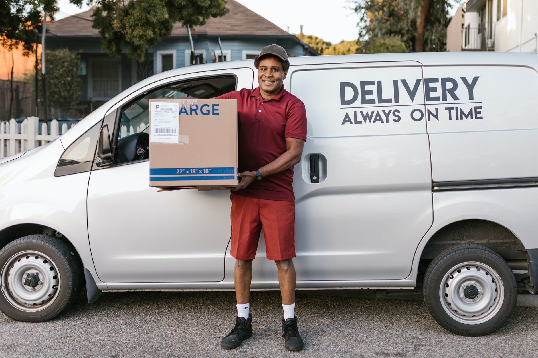 a deliveryman carrying a package